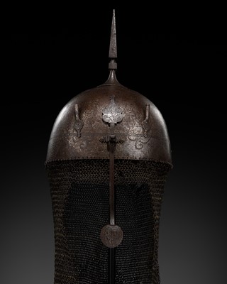 Lot 581 - A QAJAR ‘KOFTGARI’ SILVER-DAMASCENED STEEL WAR HELMET, KULAH KHUD, 19TH CENTURY