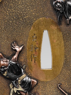 Lot 85 - OKAWA TEIKAN: A SUPERB SENTOKU AND SHAKUDO TSUBA DEPICTING A YUREI (GHOST)