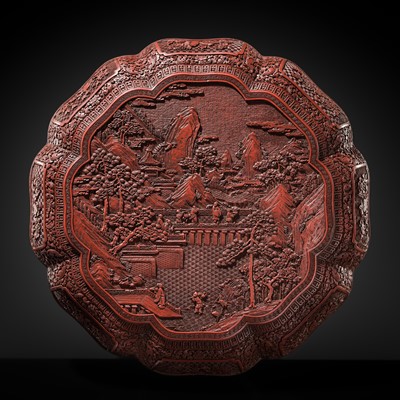 Lot 58 - A LARGE (43 CM) AND FINELY CARVED CINNABAR LACQUER OCTAGONAL BOX AND COVER, QIANLONG PERIOD (1736-1795)