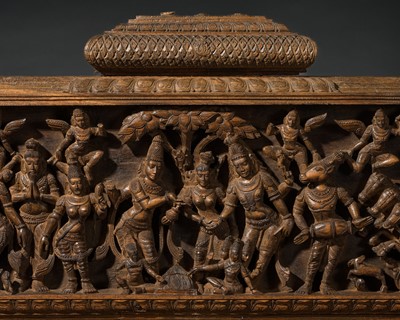 Lot 632 - A LARGE CARVED WOOD OVERDOOR PANEL DEPICTING THE MARRIAGE OF SHIVA AND PARVATI, CHETTINAD, 19TH CENTURY