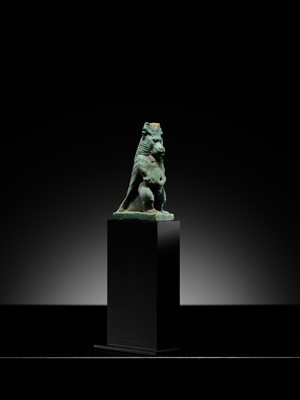 Lot 50 - A BLUE-GREEN FAIENCE ‘WINGED BABOON’ AMULET, THOTH, LATE PERIOD