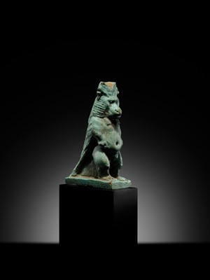 Lot 50 - A BLUE-GREEN FAIENCE ‘WINGED BABOON’ AMULET, THOTH, LATE PERIOD