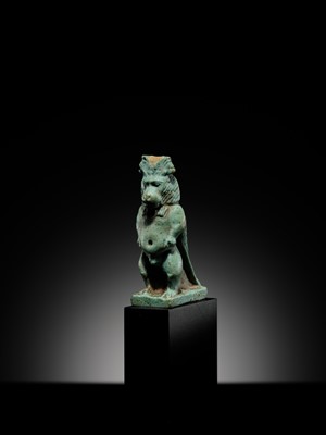Lot 50 - A BLUE-GREEN FAIENCE ‘WINGED BABOON’ AMULET, THOTH, LATE PERIOD