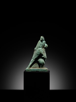 Lot 50 - A BLUE-GREEN FAIENCE ‘WINGED BABOON’ AMULET, THOTH, LATE PERIOD