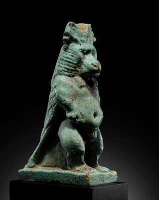 Lot 50 - A BLUE-GREEN FAIENCE ‘WINGED BABOON’ AMULET, THOTH, LATE PERIOD