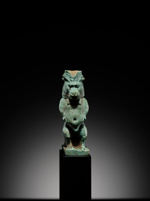 Lot 50 - A BLUE-GREEN FAIENCE ‘WINGED BABOON’ AMULET, THOTH, LATE PERIOD