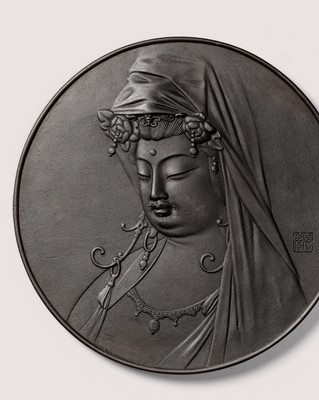A LARGE AND SUPERB ORNAMENTAL IRON PLAQUE WITH A FINE PORTRAIT OF KANNON BOSATSU, MEIJI TO TAISHO PERIOD