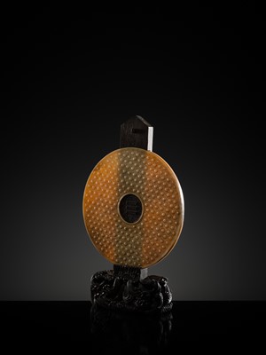Lot 125 - A HIGHLY IMPORTANT ARCHAIC YELLOW JADE BI DISK, ON AN IMPERIALLY INSCRIBED ZITAN STAND, FROM THE PERSONAL COLLECTION OF THE QIANLONG EMPEROR (HONGLI)