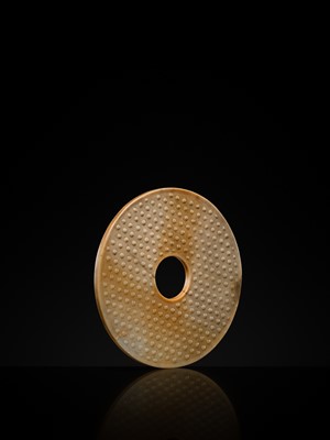 Lot 125 - A HIGHLY IMPORTANT ARCHAIC YELLOW JADE BI DISK, ON AN IMPERIALLY INSCRIBED ZITAN STAND, FROM THE PERSONAL COLLECTION OF THE QIANLONG EMPEROR (HONGLI)