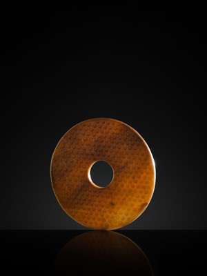 Lot 125 - A HIGHLY IMPORTANT ARCHAIC YELLOW JADE BI DISK, ON AN IMPERIALLY INSCRIBED ZITAN STAND, FROM THE PERSONAL COLLECTION OF THE QIANLONG EMPEROR (HONGLI)