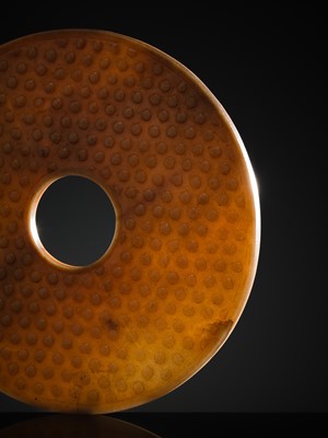Lot 125 - A HIGHLY IMPORTANT ARCHAIC YELLOW JADE BI DISK, ON AN IMPERIALLY INSCRIBED ZITAN STAND, FROM THE PERSONAL COLLECTION OF THE QIANLONG EMPEROR (HONGLI)