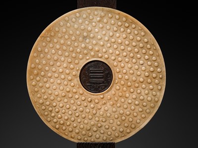 Lot 125 - A HIGHLY IMPORTANT ARCHAIC YELLOW JADE BI DISK, ON AN IMPERIALLY INSCRIBED ZITAN STAND, FROM THE PERSONAL COLLECTION OF THE QIANLONG EMPEROR (HONGLI)