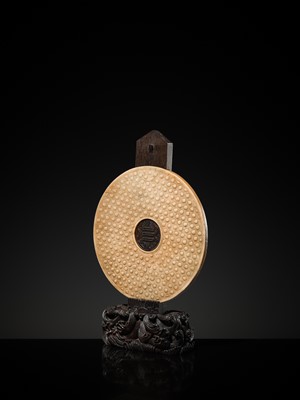Lot 125 - A HIGHLY IMPORTANT ARCHAIC YELLOW JADE BI DISK, ON AN IMPERIALLY INSCRIBED ZITAN STAND, FROM THE PERSONAL COLLECTION OF THE QIANLONG EMPEROR (HONGLI)