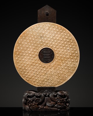 Lot 125 - A HIGHLY IMPORTANT ARCHAIC YELLOW JADE BI DISK, ON AN IMPERIALLY INSCRIBED ZITAN STAND, FROM THE PERSONAL COLLECTION OF THE QIANLONG EMPEROR (HONGLI)