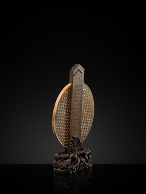 Lot 125 - A HIGHLY IMPORTANT ARCHAIC YELLOW JADE BI DISK, ON AN IMPERIALLY INSCRIBED ZITAN STAND, FROM THE PERSONAL COLLECTION OF THE QIANLONG EMPEROR (HONGLI)