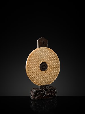 Lot 125 - A HIGHLY IMPORTANT ARCHAIC YELLOW JADE BI DISK, ON AN IMPERIALLY INSCRIBED ZITAN STAND, FROM THE PERSONAL COLLECTION OF THE QIANLONG EMPEROR (HONGLI)