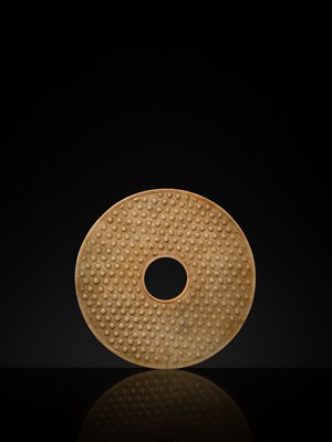 Lot 125 - A HIGHLY IMPORTANT ARCHAIC YELLOW JADE BI DISK, ON AN IMPERIALLY INSCRIBED ZITAN STAND, FROM THE PERSONAL COLLECTION OF THE QIANLONG EMPEROR (HONGLI)