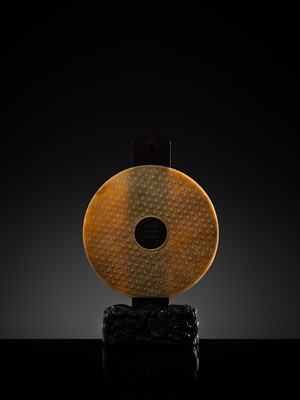 Lot 125 - A HIGHLY IMPORTANT ARCHAIC YELLOW JADE BI DISK, ON AN IMPERIALLY INSCRIBED ZITAN STAND, FROM THE PERSONAL COLLECTION OF THE QIANLONG EMPEROR (HONGLI)