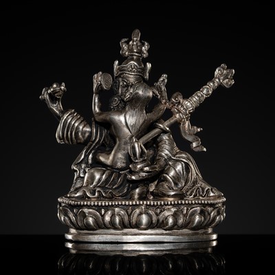 Lot 319 - A RARE SILVER FIGURE OF PADMASAMBHAVA IN UNION WITH HIS CONSORT MANDARAVA, TIBET, 18TH-19TH CENTURY