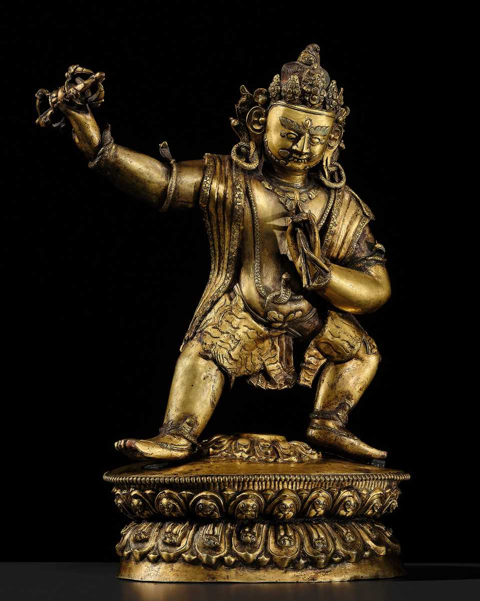 Lot 32 - A LARGE GILT-BRONZE FIGURE OF VAJRAPANI, TIBET, 16TH-17TH CENTURY