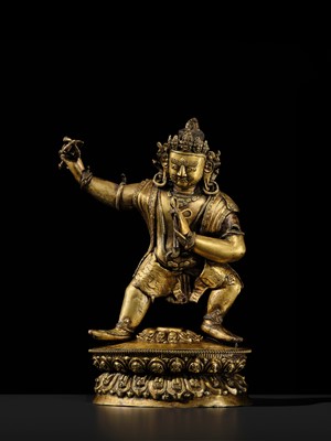 Lot 32 - A LARGE GILT-BRONZE FIGURE OF VAJRAPANI, TIBET, 16TH-17TH CENTURY