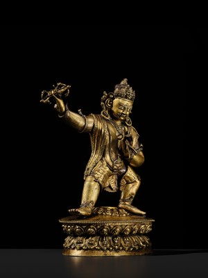 Lot 32 - A LARGE GILT-BRONZE FIGURE OF VAJRAPANI, TIBET, 16TH-17TH CENTURY