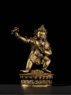 Lot 32 - A LARGE GILT-BRONZE FIGURE OF VAJRAPANI, TIBET, 16TH-17TH CENTURY