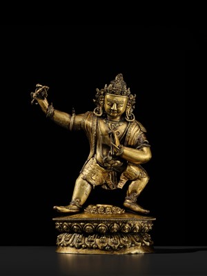 Lot 32 - A LARGE GILT-BRONZE FIGURE OF VAJRAPANI, TIBET, 16TH-17TH CENTURY