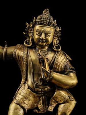 Lot 32 - A LARGE GILT-BRONZE FIGURE OF VAJRAPANI, TIBET, 16TH-17TH CENTURY