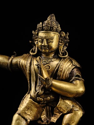 Lot 32 - A LARGE GILT-BRONZE FIGURE OF VAJRAPANI, TIBET, 16TH-17TH CENTURY