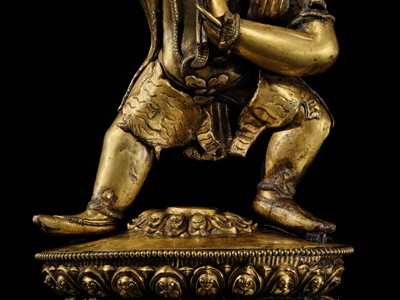 Lot 32 - A LARGE GILT-BRONZE FIGURE OF VAJRAPANI, TIBET, 16TH-17TH CENTURY