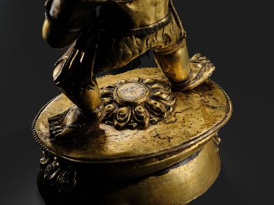 Lot 32 - A LARGE GILT-BRONZE FIGURE OF VAJRAPANI, TIBET, 16TH-17TH CENTURY