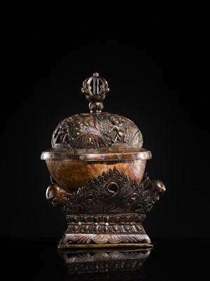 Lot 33 - A KAPALA (SKULL CUP) WITH SEPARATE COPPER ALLOY COVER AND STAND, TIBET, 18TH-19TH CENTURY
