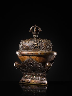 Lot 33 - A KAPALA (SKULL CUP) WITH SEPARATE COPPER ALLOY COVER AND STAND, TIBET, 18TH-19TH CENTURY