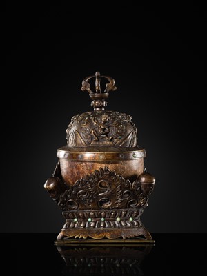 Lot 33 - A KAPALA (SKULL CUP) WITH SEPARATE COPPER ALLOY COVER AND STAND, TIBET, 18TH-19TH CENTURY