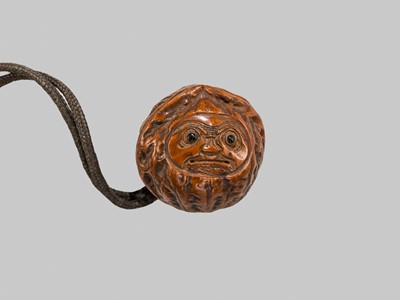 Lot 5 - A RARE THREE-CASE RYUKYUAN TSUIKIN LACQUER INRO WITH A FINE KURUMI NETSUKE OF DARUMA