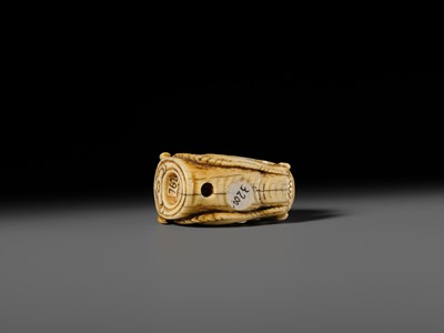 Lot 113 - A VERY RARE CORAL INLAID IVORY NETSUKE OF A SEVERED DRAGON HEAD