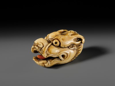 Lot 113 - A VERY RARE CORAL INLAID IVORY NETSUKE OF A SEVERED DRAGON HEAD