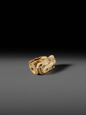 Lot 113 - A VERY RARE CORAL INLAID IVORY NETSUKE OF A SEVERED DRAGON HEAD