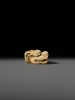 Lot 113 - A VERY RARE CORAL INLAID IVORY NETSUKE OF A SEVERED DRAGON HEAD