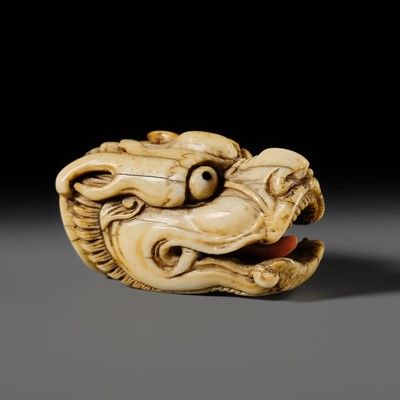 Lot 113 - A VERY RARE CORAL INLAID IVORY NETSUKE OF A SEVERED DRAGON HEAD
