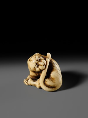 Lot 108 - TADAMITSU: A SUPERB AND RARE KYOTO SCHOOL IVORY NETSUKE OF A TIGER