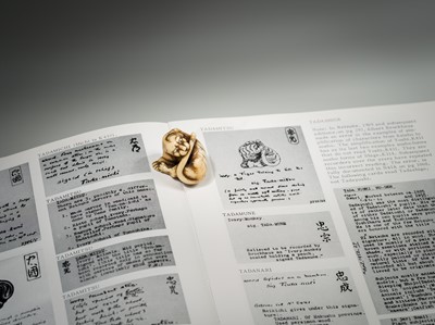 Lot 108 - TADAMITSU: A SUPERB AND RARE KYOTO SCHOOL IVORY NETSUKE OF A TIGER