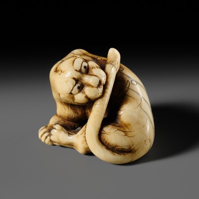 Lot 108 - TADAMITSU: A SUPERB AND RARE KYOTO SCHOOL IVORY NETSUKE OF A TIGER