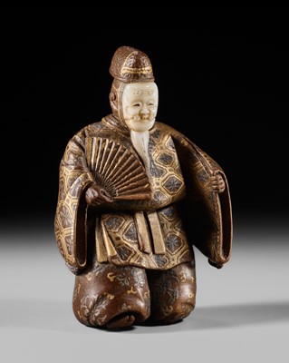 Lot 272 - A FINE TOKYO SCHOOL LACQUERED AND INLAID WOOD NETSUKE OF AN OKINA DANCER