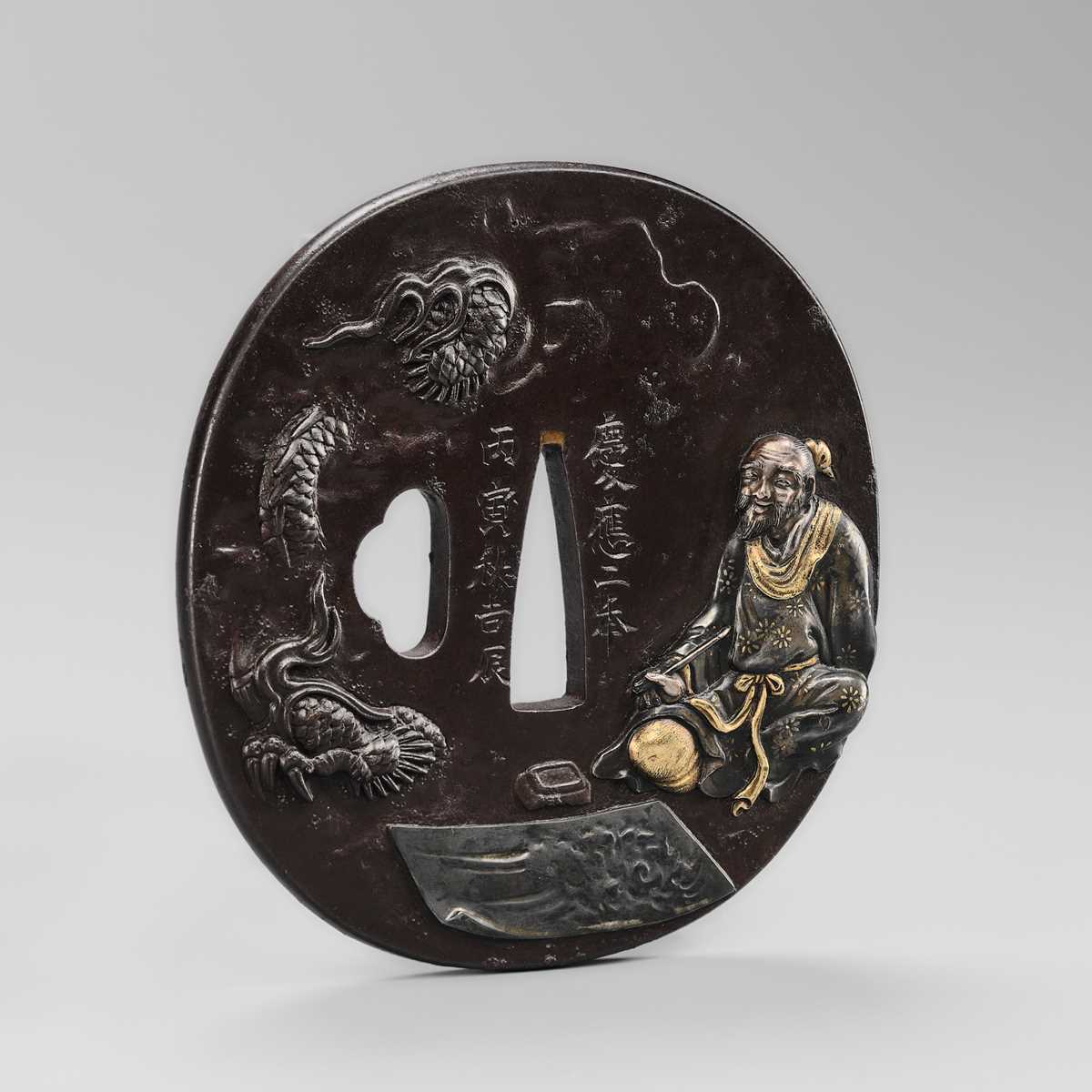 WATAI TANETORA: A SUPERB MITO SCHOOL IRON TSUBA DEPICTING SO FUKO AND DRAGON, DATED 1866