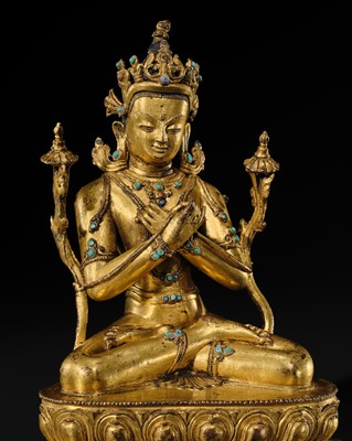 Lot 16 - AN INLAID GILT-BRONZE FIGURE OF VAJRADHARA, NEPAL, MALLA PERIOD, 15TH CENTURY