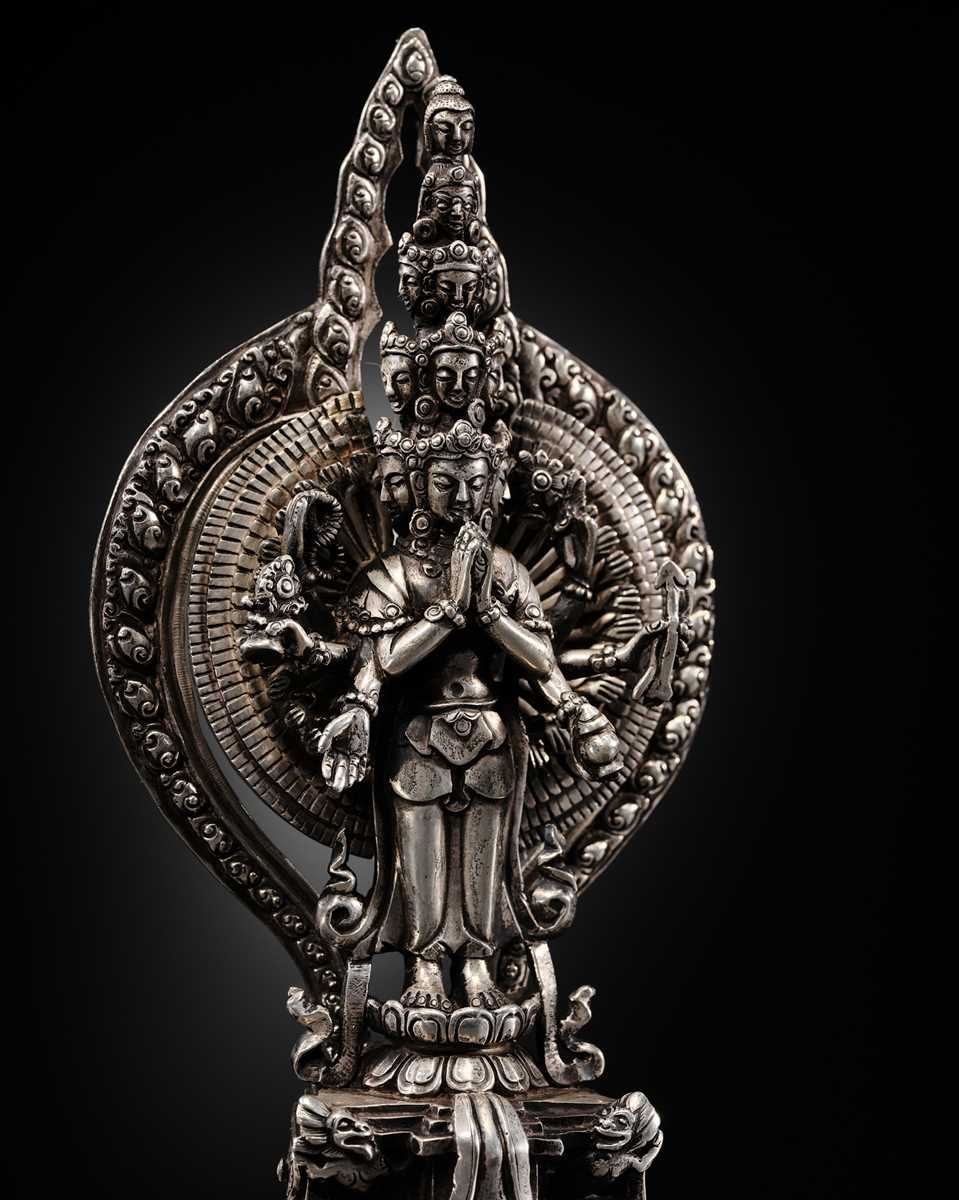 Lot 34 - A SILVER FIGURE OF AVALOKITESHVARA SAHASRABHUJA EKADASAMUKHA