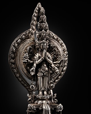 Lot 34 - A SILVER FIGURE OF AVALOKITESHVARA SAHASRABHUJA EKADASAMUKHA