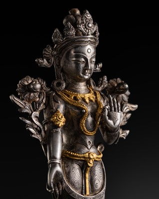 Lot 327 - A PARCEL-GILT SILVER FIGURE OF PADMAPANI LOKESHVARA, TIBET, CIRCA 1800